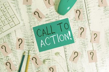 Text sign showing Call To Action. Business photo text exhortation do something in order achieve aim with problem Writing tools, computer stuff and scribbled paper on top of wooden table