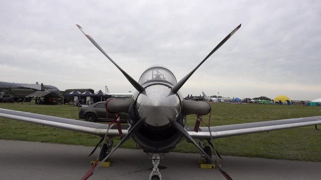 Military Plane Strapped Down On Ground On Windy Day