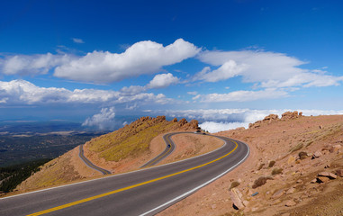 Fototapeta na wymiar Looking down on the road that takes visitors to and from the summit of Pikes Peak.