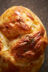 Cheese bread, dried parsley on top 