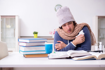 Sick male student suffering at home