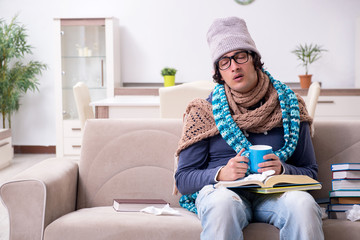 Sick male student suffering at home