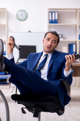 Young male businessman working in the office