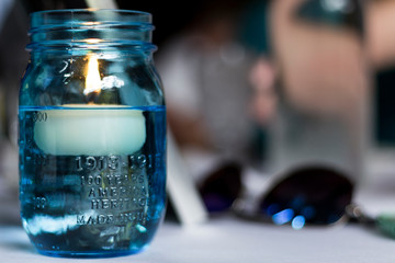 candle floating in water