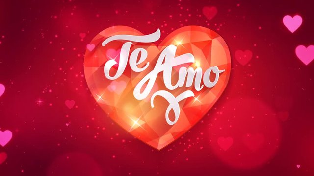 Te Amo - I love you in spanish language on red ruby jewel gemstone on blur looped background