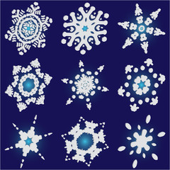 Collection of cute snowflakes on blue background.