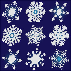 Kit of simple, beautiful snowflakes on blue background.