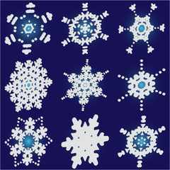 Kit of simple, beautiful snowflakes on blue background.