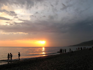 Fototapeta na wymiar silhouette of man on beach at sunset