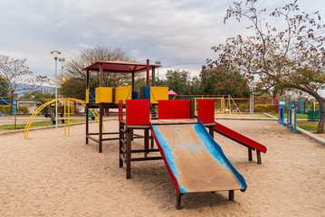 Children kid playground for leisure and recreation activity with toy and slider leftover in the...