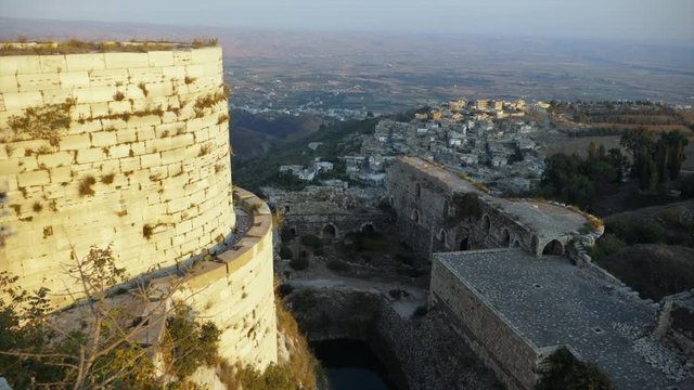 High atop the Krak des Chevaliers castle looking down at the valley below in Syria