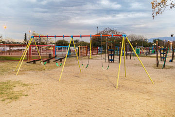 Children kid playground for leisure and recreation activity with toy and slider leftover in the...