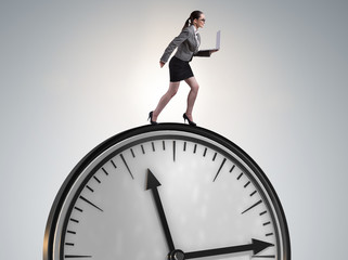 The businesswoman in time management concept