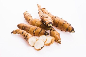 Raw Whole Jerusalem artichokes on a white background
