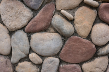 Colorful stone wall texture of various shapes