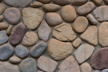 Colorful stone wall texture of various shapes