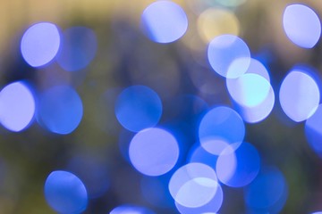 Blue bokeh balls background, defocused full frame image with room for text.