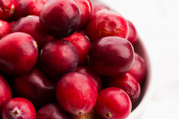 Ceramic bowl of Cranberry on white background