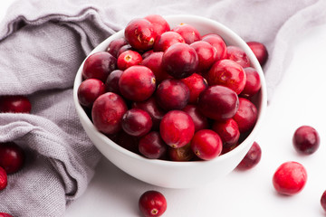 Ceramic bowl of Cranberry on white background