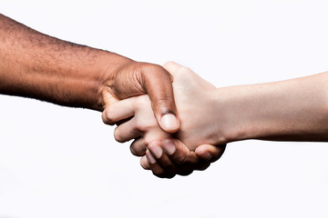 African man and Caucasian woman shake hands, studio shot, isolated