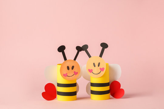 Decoration for valentine day, bithday, baby shower home party toys made with toilet paper roll. Handicraft bee with red hearts, concept of eco-friendly reuse diy creative idea