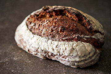 Hard black color bread on stone background