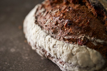 Hard black color bread on stone background