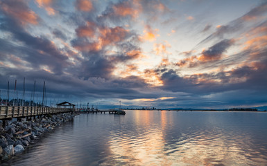 Fototapeta na wymiar Dramatic sunrise at Comox may marina, Comox, British Columbia, Canada