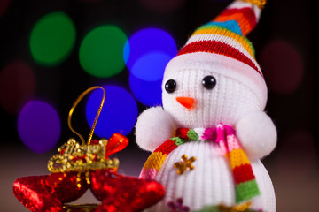 Festive snowman with Christmas light background