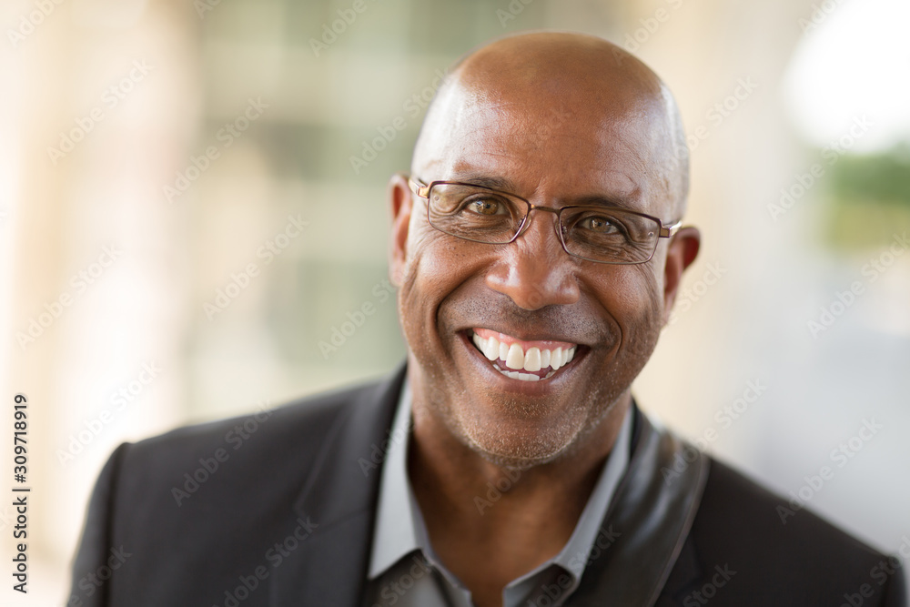 Wall mural portrait of a mature african american businessman on his way to work.