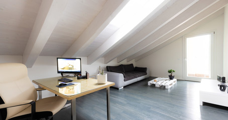 studio room with exposed beams and parquet