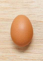 Hen brown egg  freshness  On wood close up isolated space for background texture