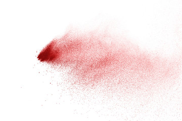 Explosion of red powder on black background