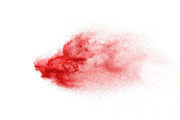 Explosion of red powder on black background