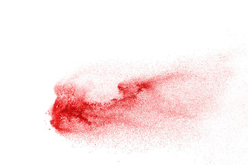 Explosion of red powder on black background