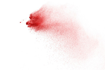 Explosion of red powder on black background