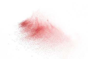 Explosion of red powder on black background