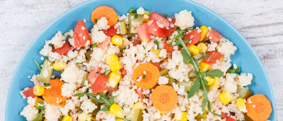 Fresh salad with couscous and vegetables. Light dietary vegan meal