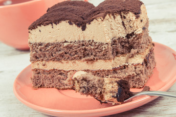 Tasty creamy tiramisu cake and black coffee for different occasions. Delicious dessert