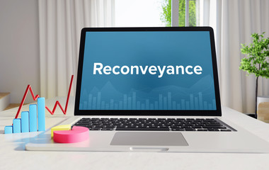 Reconveyance – Statistics/Business. Laptop in the office with term on the Screen. Finance/Economy.