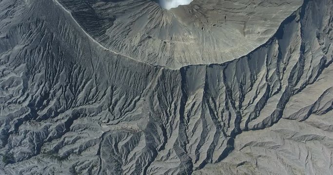 Aerial footage. Crater with active volcano smoke in Bali, Indonesia. Travel concept. Asian scenic shot. 4k