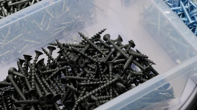 screws and dowels in a plastic box