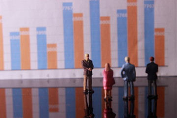 Simple Illustration Photo,Gruap of Man and Woman doing a Business meeting with graphic Chart as a background