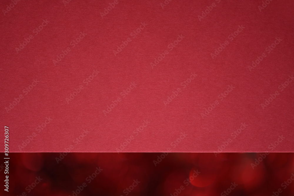 Sticker closeup textured red paper with christmas red bokeh. macro.