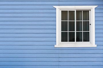 White frame window on blue wooden wall with copy space. - 309726790