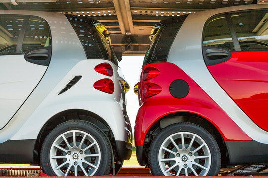 Two Smart Cars At A Car Transportation Lorry At The Highway