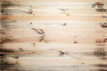 Natural wood surface with black paint residues. Copy space. Advertisement. Background.