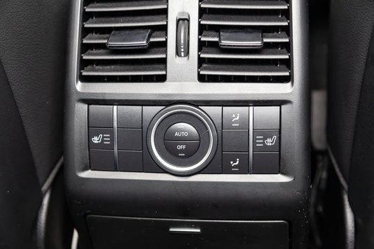  Interior view with rear climate-control dashboard of luxury very expensive new white Mercedes-Benz GLS 350d SUV car stands in the washing box