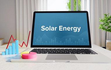 Solar Energy – Statistics/Business. Laptop in the office with term on the Screen. Finance/Economy.