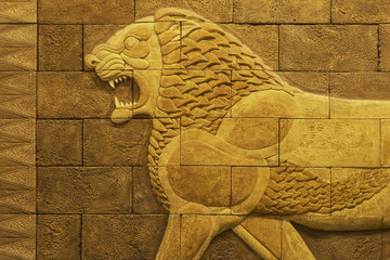 Image of a lion on a yellow porous brick wall in the Sumerian style of ancient Babylon
